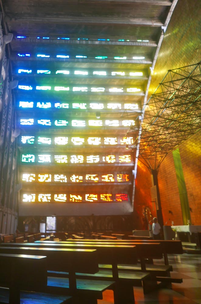 Rainbow light through the glass-stained windows of the Iglesia El Rosario in San Salvador