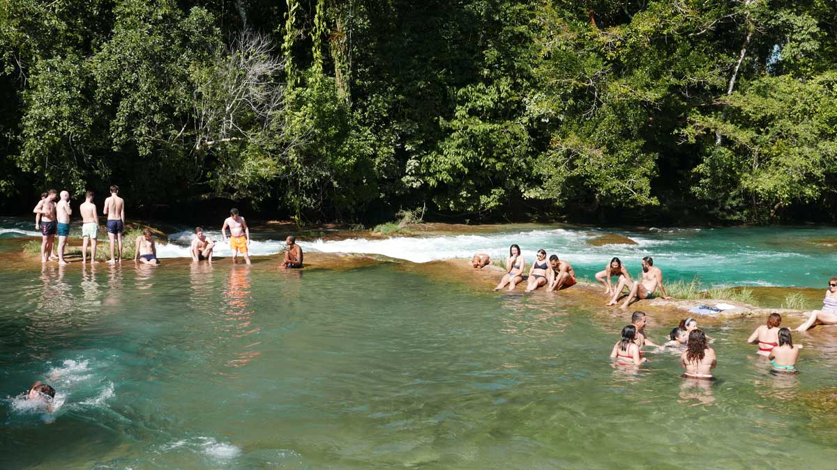 Tourists swimming at Agua Azul waterfalls in Mexico