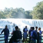 Tourists at Agua Azul waterfalls in Mexico
