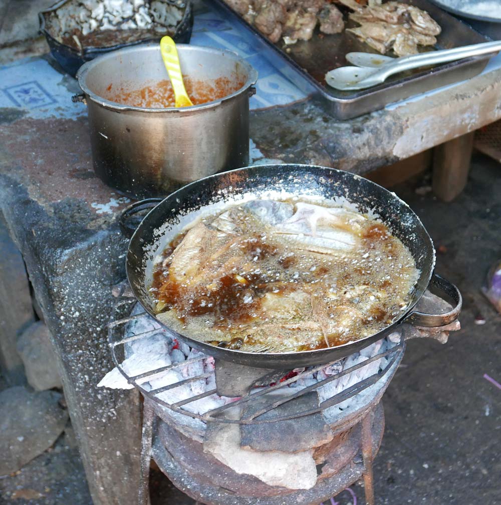 Frying fish on the street market in Granada, Nicaragua