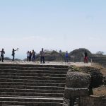 Tourists on the northern temple of the Monte Alban archaelogical ruins near Oaxaca in Mexico