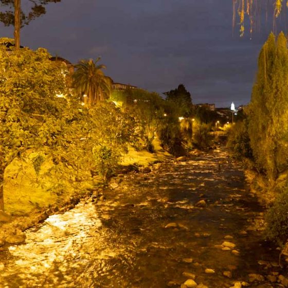 Tomebamba river by night in Cuenca