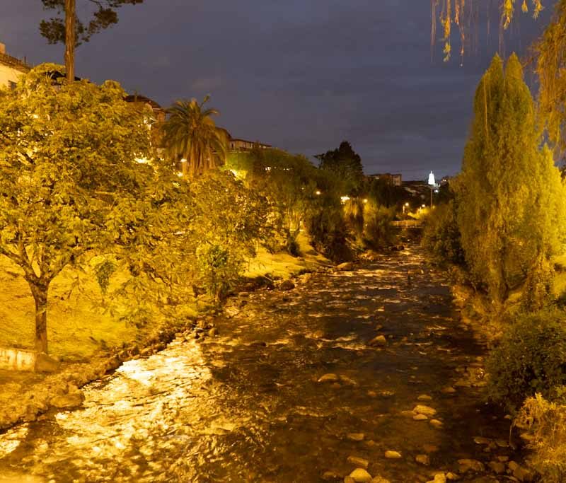 Tomebamba river by night in Cuenca