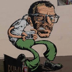 Street art: man with camera in Guayaquil