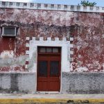 Red house with falling paint in Valladolid